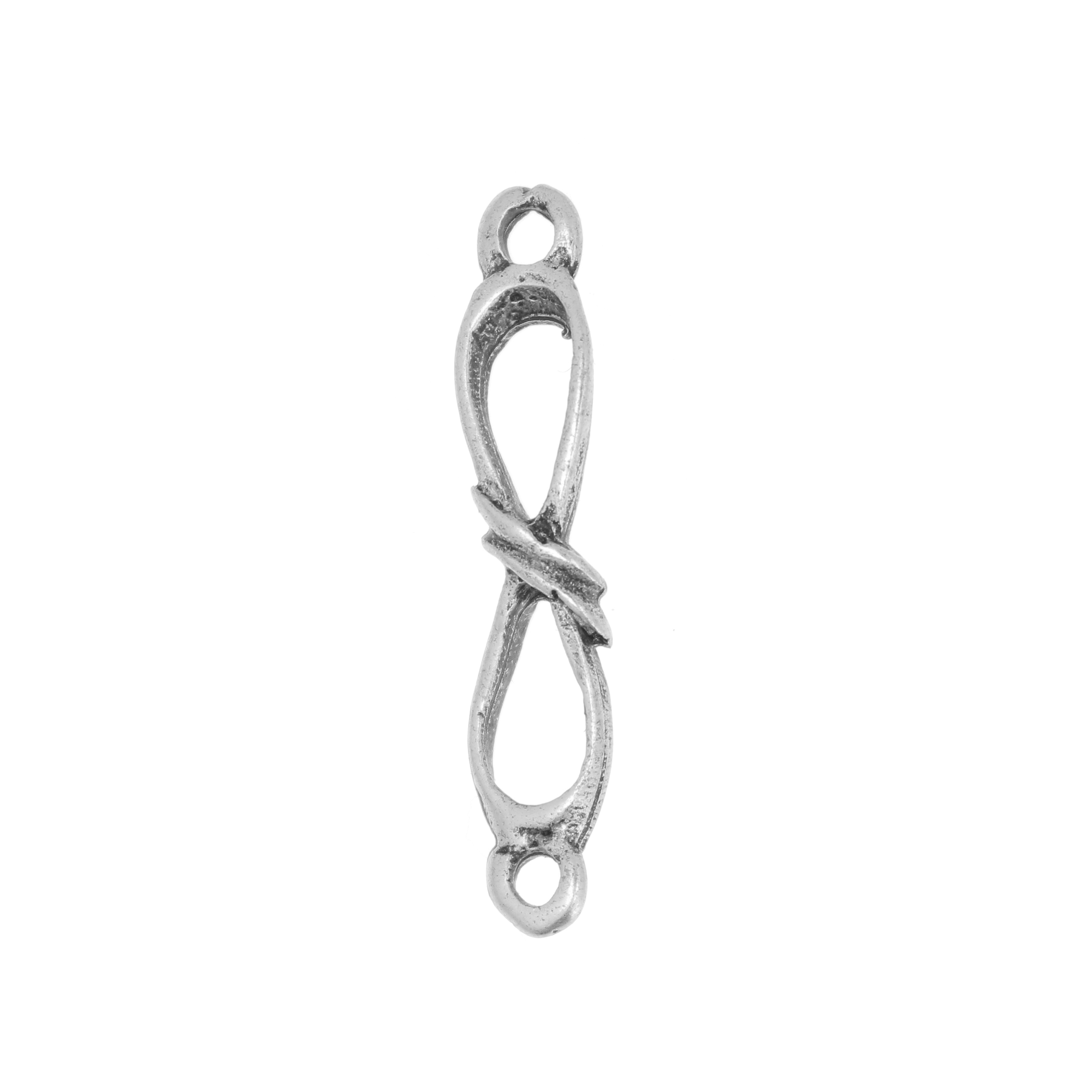 Accessorio a forma di "8" allungato, ritorto due volte, con due anelli, 7x30 mm.