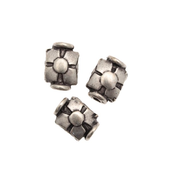 Distanziatore rettangolare con disegno a quattro punte e cerchio centrale, 7x10 mm.
