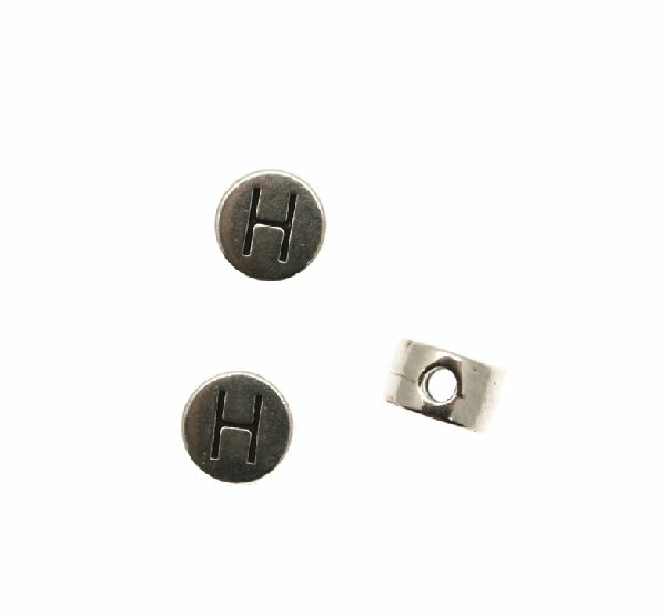 Distanziatore tondo piatto liscio, con disegno lettera "H", 7x4 mm.