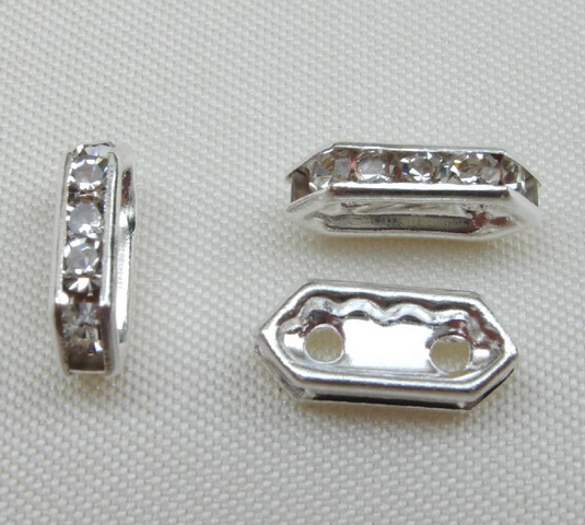 Ponte strass piatto con 2 fori e strass color Crystal, 10 mm.