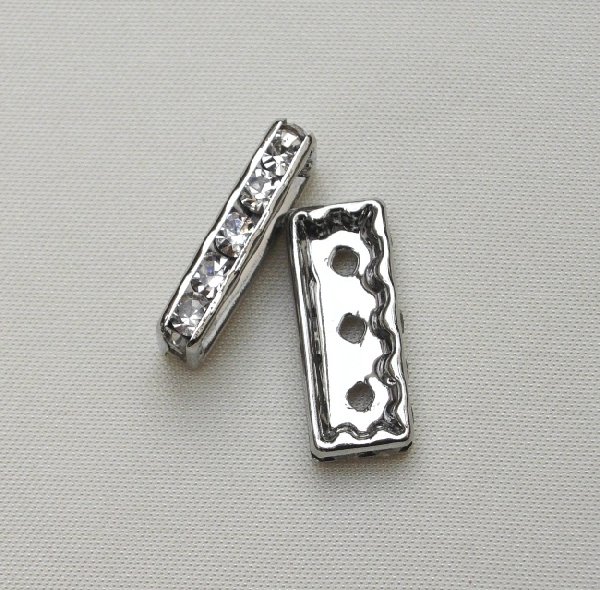 Ponte strass piatto rettangolare con 3 fori, 19x9 mm., colore strass Crystal