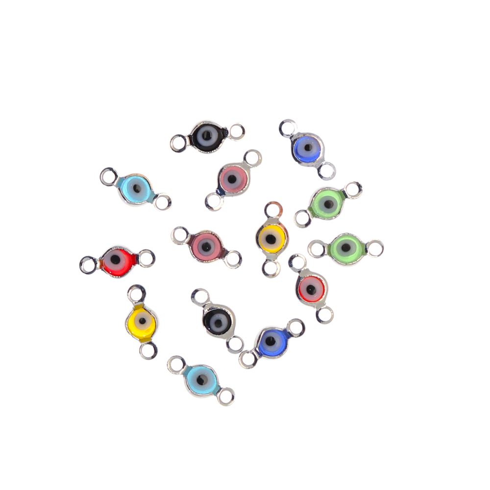 Elemento a doppio anello con incastonato un occhietto in vetro, misura 4,5x10 mm., colori misti base in metallo colore Argentato Rodio