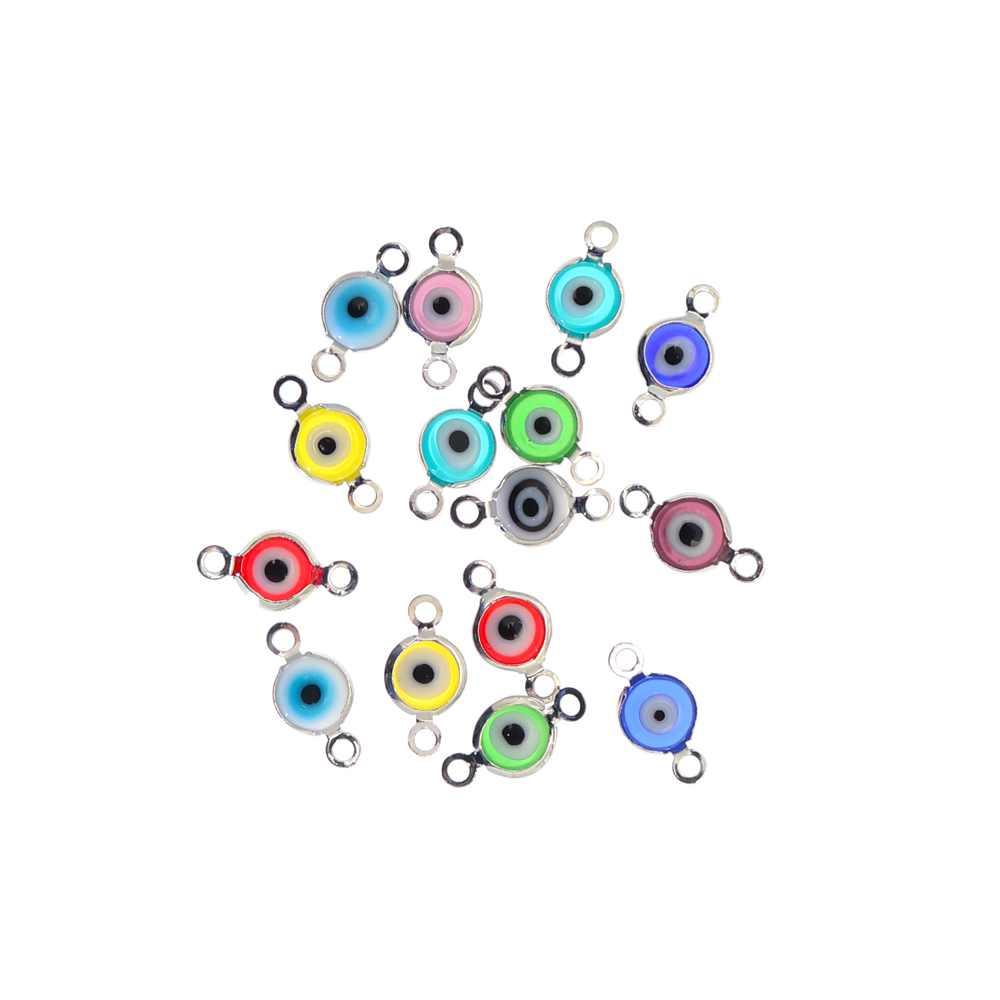 Elemento a doppio anello con incastonato un occhietto in vetro, misura 6,5x13 mm., colori misti base in metallo colore Argentato Rodio