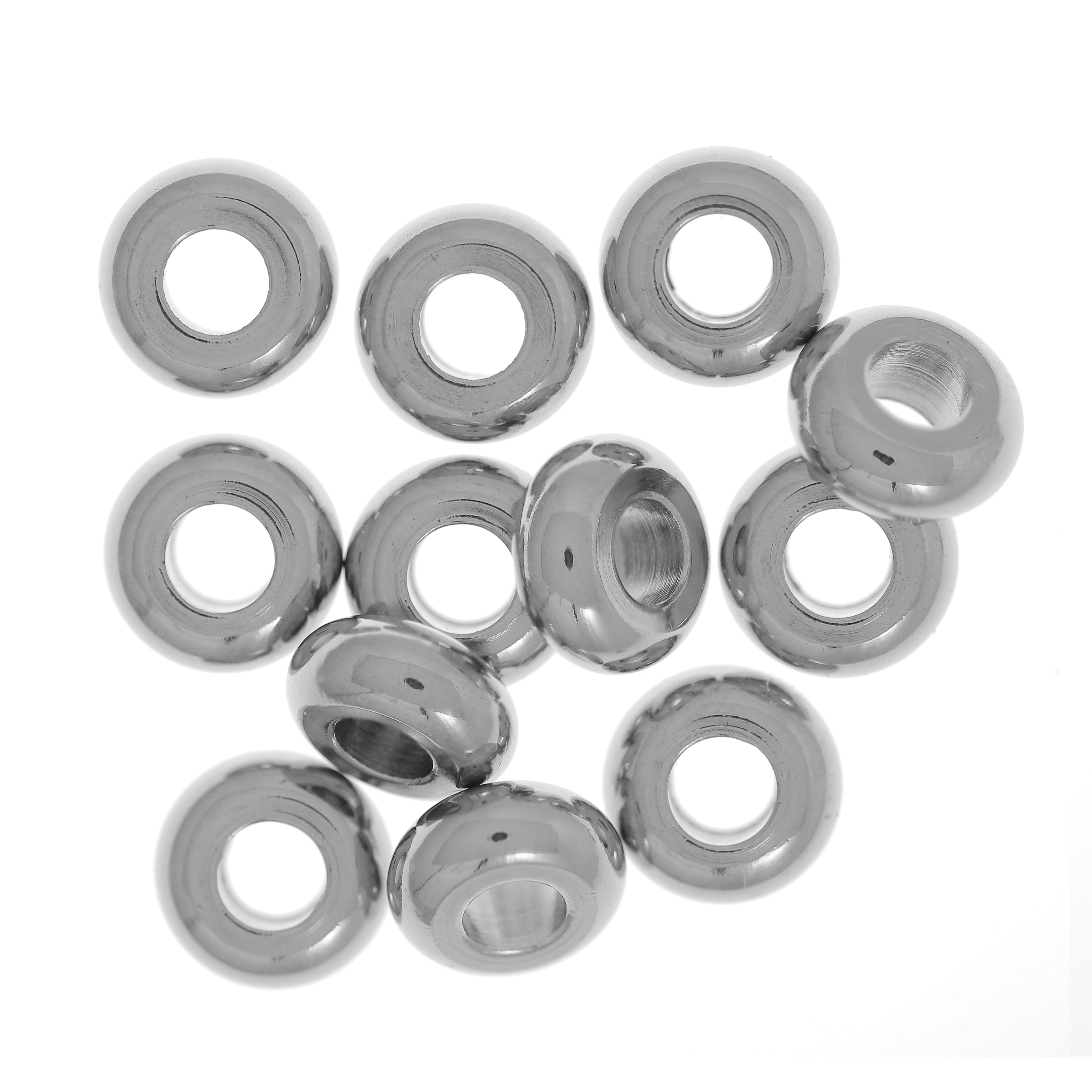 Distanziatore a forma di rondella liscia, leggermente bombata, 4x1,6x1,8 mm., in Acciaio