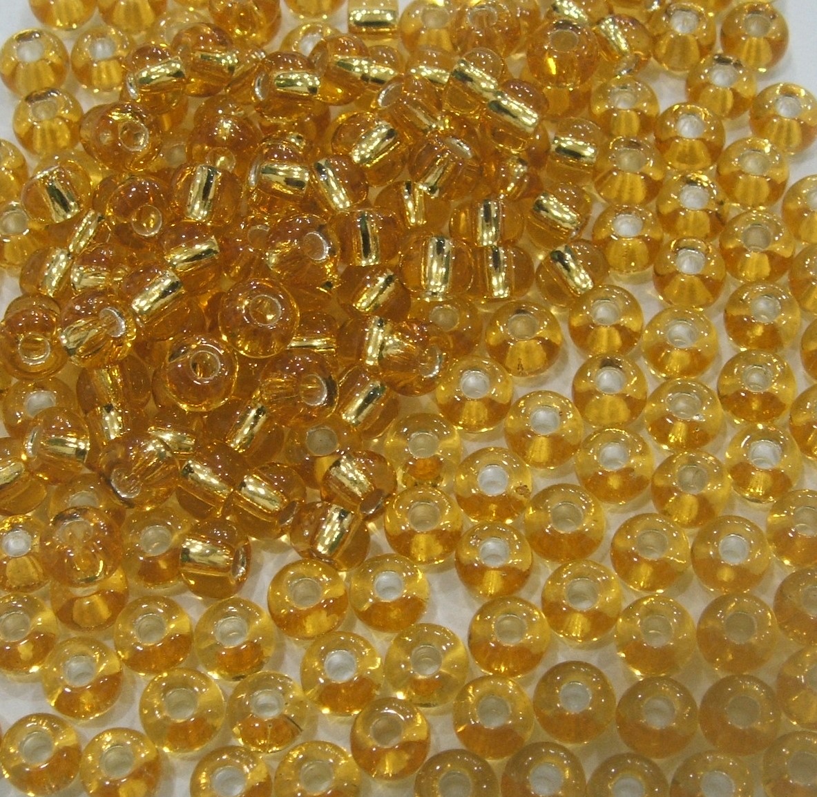 Conteria in vetro, dimensione 4,5x3mm., colore Trasparente con Oro